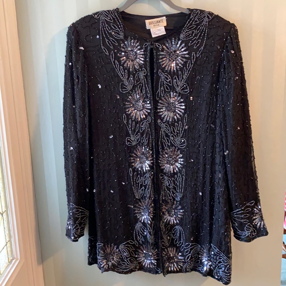 Sparkle your way into the room with this beautiful sequined jacket.